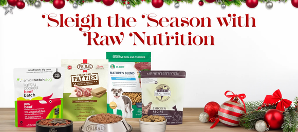 Festive holiday pet food display with various brands of dog food against a white backdrop. 